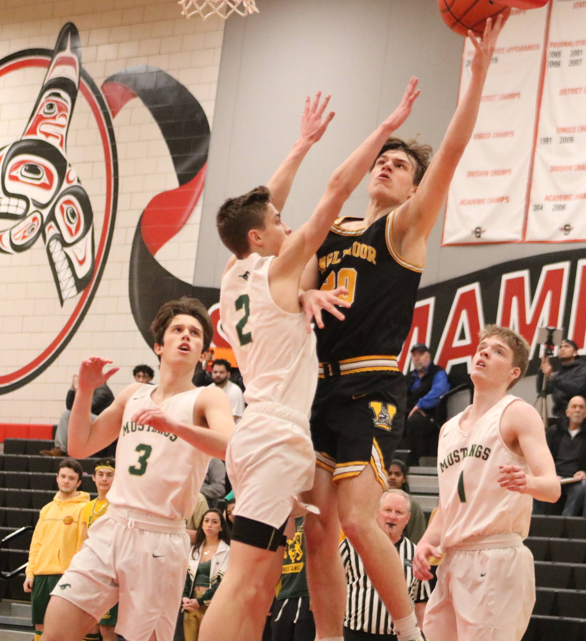 Inglemoor guard Brady Castro goes to the hoop during a 4A KingCo league tournament game on Jan. 8 at Sammamish High School. Benjamin Olson/staff photo