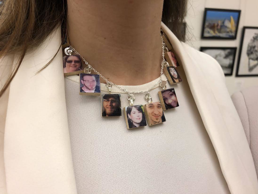 Van Buecken wears her necklace that has pictures of diabetics who died from insulin rationing. Photo courtesy of Suzan DelBene