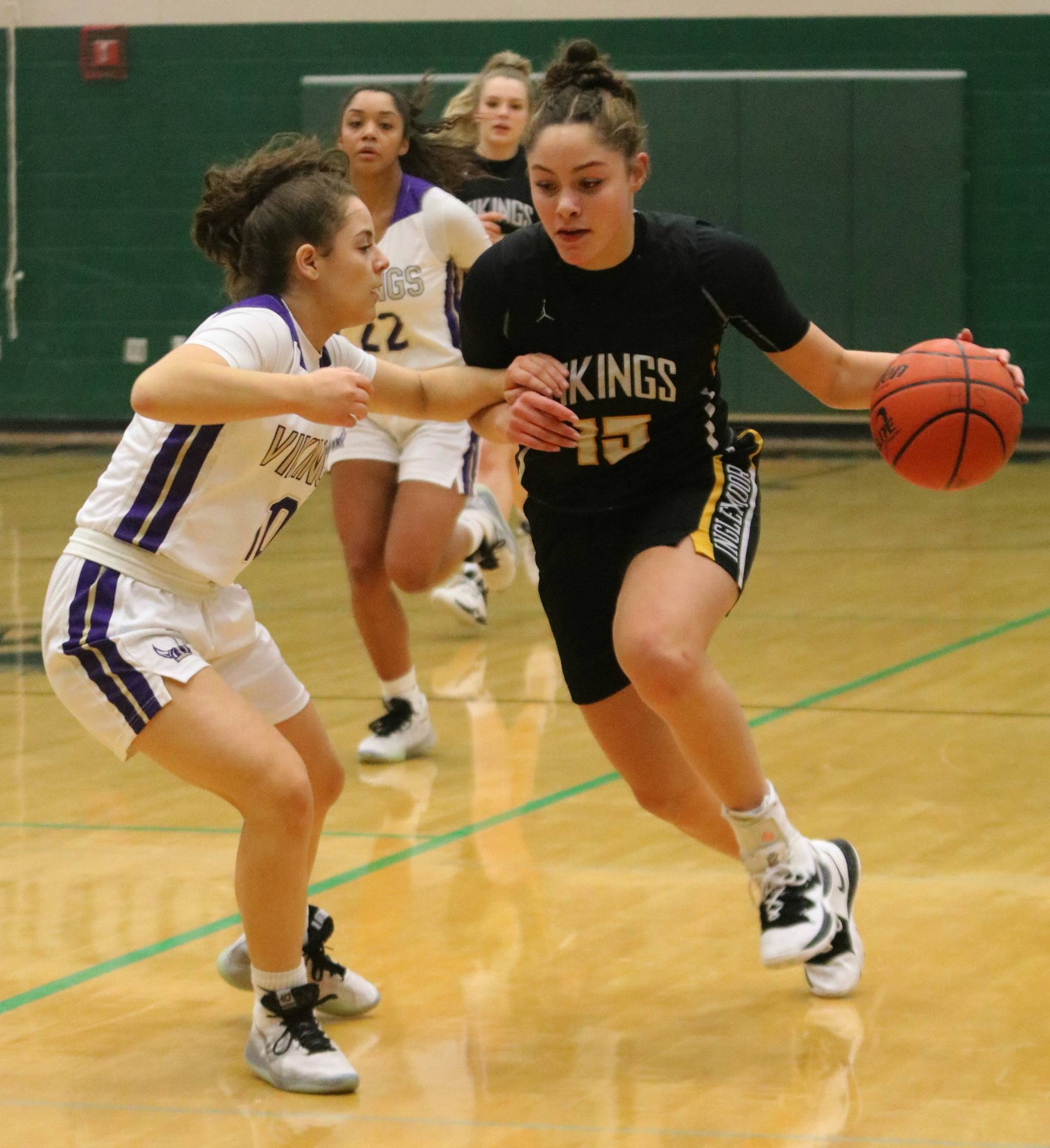 Inglemoor’s Isabella Reed, right, drives up court against Lake Stevens. Andy Nystrom/ staff photo
