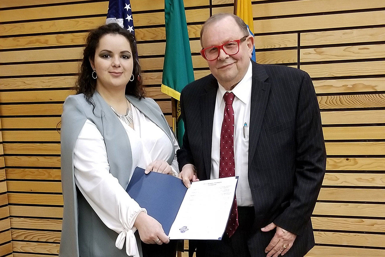 Photo courtesy city of Kenmore                                Nadia Reigna Silver, who gave an address in commemoration of Black History Month, standing with Mayor David Baker at the Feb. 24 Kenmore City Council meeting.
