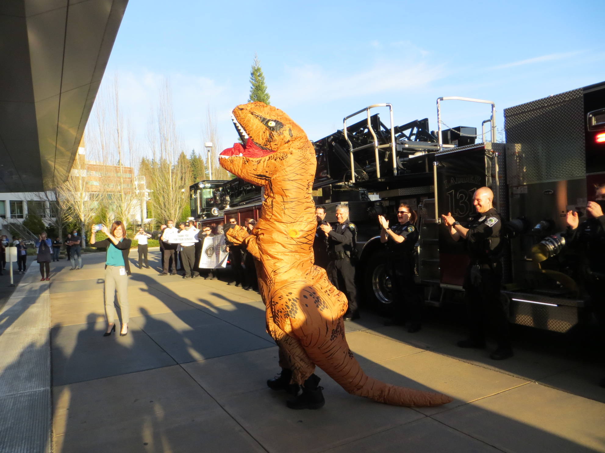A Tyrannosaurus rex stops by EvergreenHealth Medical Center in Kirkland to show his appreciation for the doctors and nurses working at the hospital. Samantha Pak/staff photo