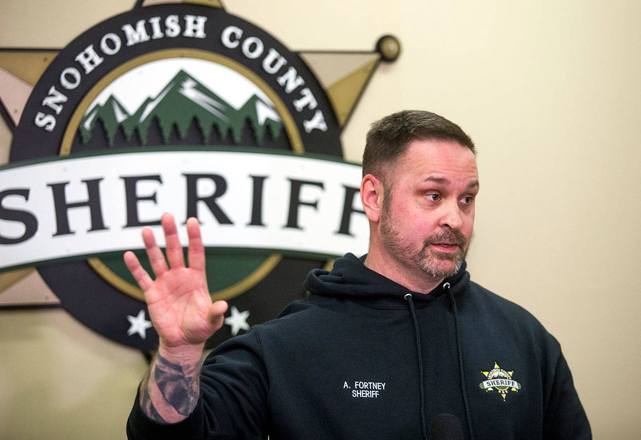 Sheriff Adam Fortney, seen here at a press conference on Jan. 28 in Everett, says he will not enforce the governor’s stay-home order. (Andy Bronson / Herald file)