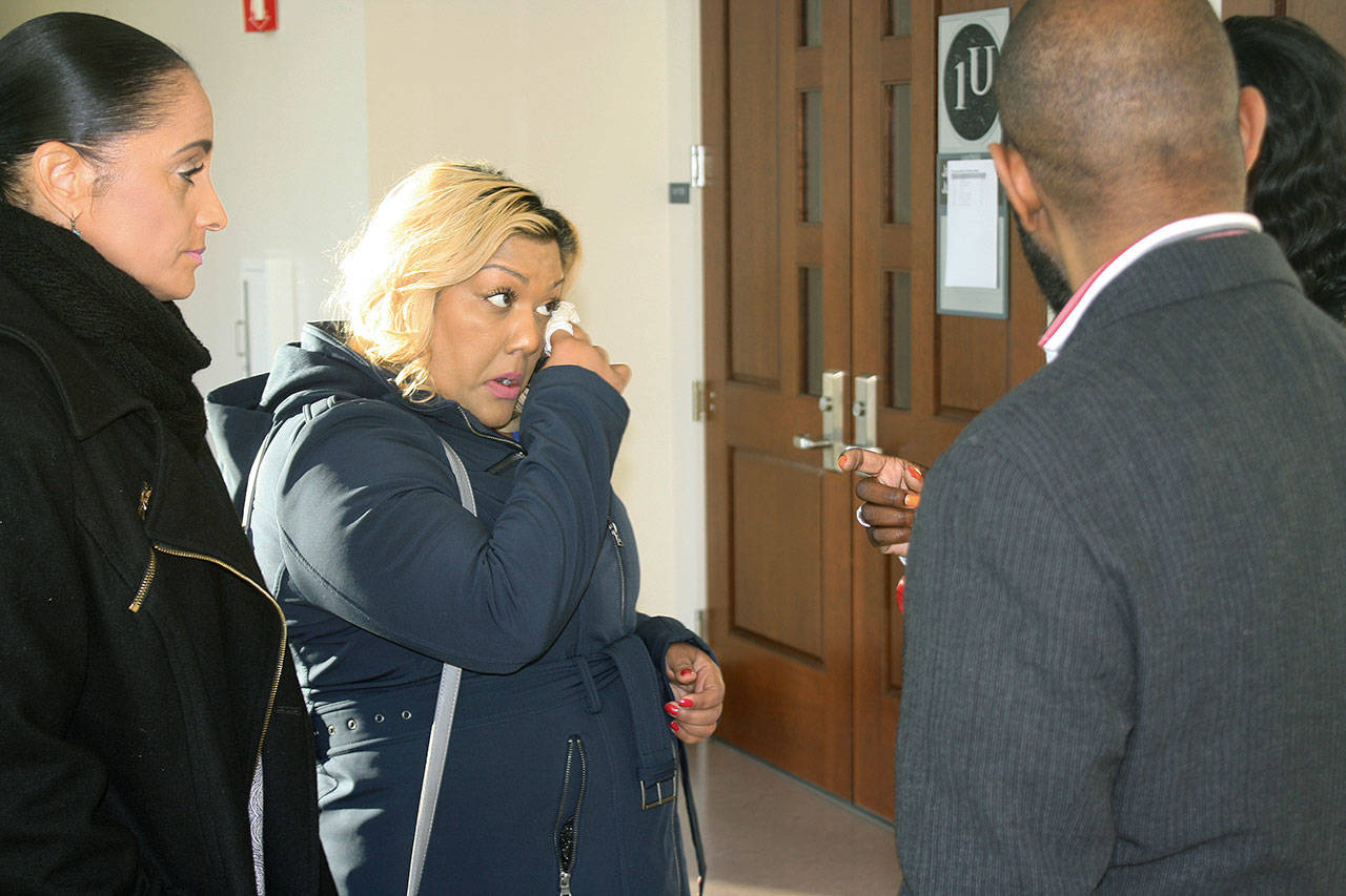 Sonia Joseph wipes away a tear in this December 2017 photo prior to entering the inquest hearing at the Maleng Regional Justice Center in Kent into the fatal shooting of her son Giovonn Joseph-McDade by a Kent police officer in June 2017. File photo