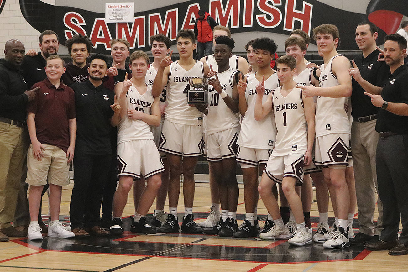 The Mercer Island boys basketball celebrates their 61-36 victory over Interlake in the 3A KingCo championship game on Feb. 11, 2020, at Sammamish High School. File photo