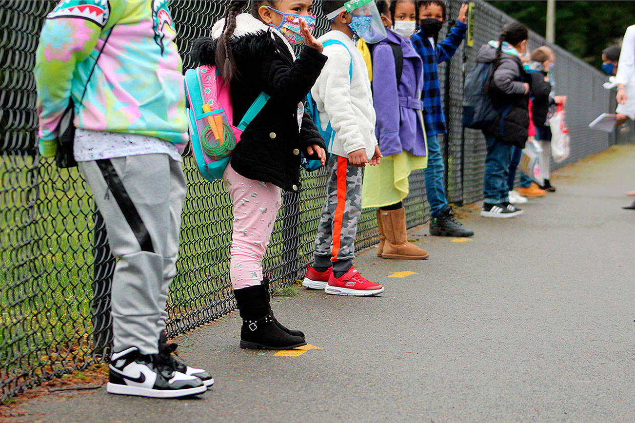 Kindergarten and first grade students line up outside of Panther Lake Elementary in Federal Way on March 15. Olivia Sullivan/the Mirror