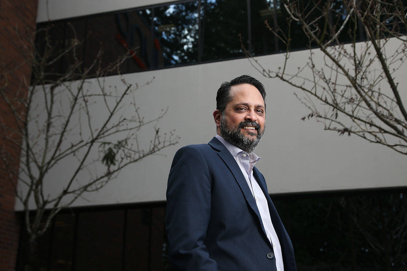 Snehal Patel, Global Head of Cell Therapy Manufacturing at Bristol Myers Squibb, stand outside the facility on Monday, March 29, 2021 in Bothell, Washington. A Bristol Myers Squibb facility in Bothell is one of four facilities in the United States where the company supercharges a person's T-cells to better fight blood cancers. The facility uses a virus  -- a viral delivery system -- to add punch to an individual's T-cells. The T-cells are then returned to the person better-equipped to destroy cancer cells.  (Andy Bronson / The Herald)