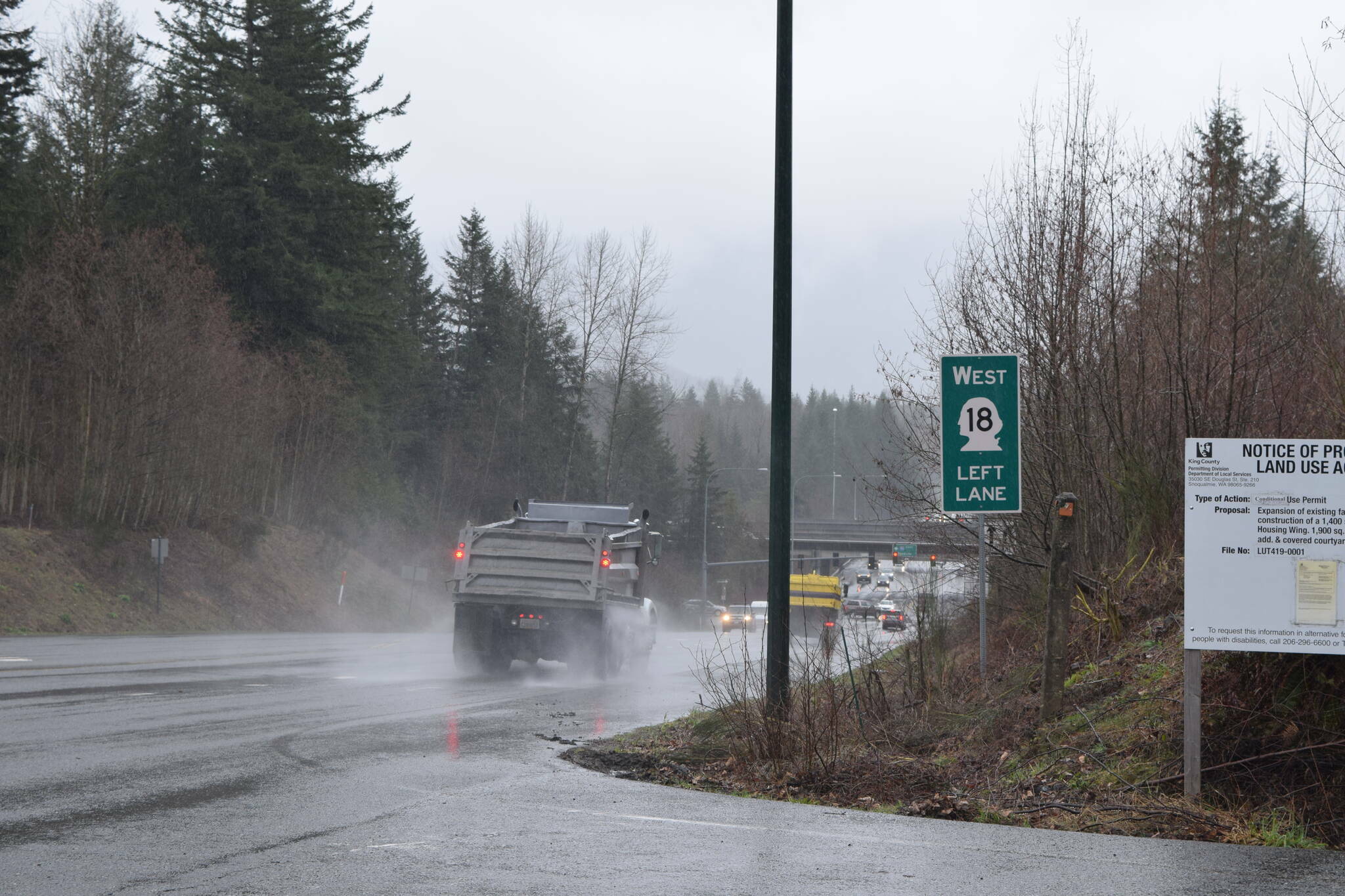 A State Route 18 sign in Snoqualmie before the SR 18/I-90 interchange. File photo Conor Wilson/Valley Record.