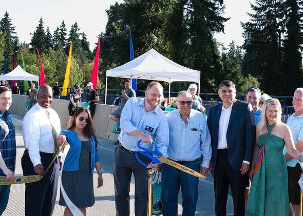 Mayor Nigel Herbig smiles as he cuts the ribbon at the West Sammamish River Bridge grand opening celebration on August 11. Courtesy of the City of Kenmore.