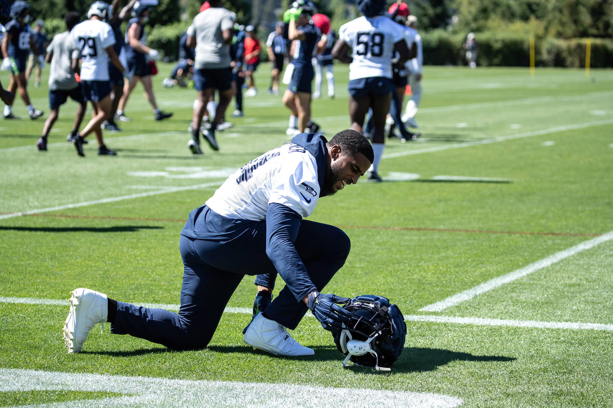 Bobby Wagner getting some stretching in on the sidelines. (Maria Dorsten Photography)