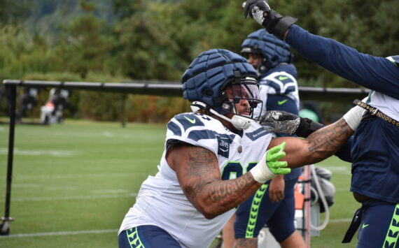 Byron Murphy II gets going during a defensive line drill. Ben Ray / Sound Publishing
