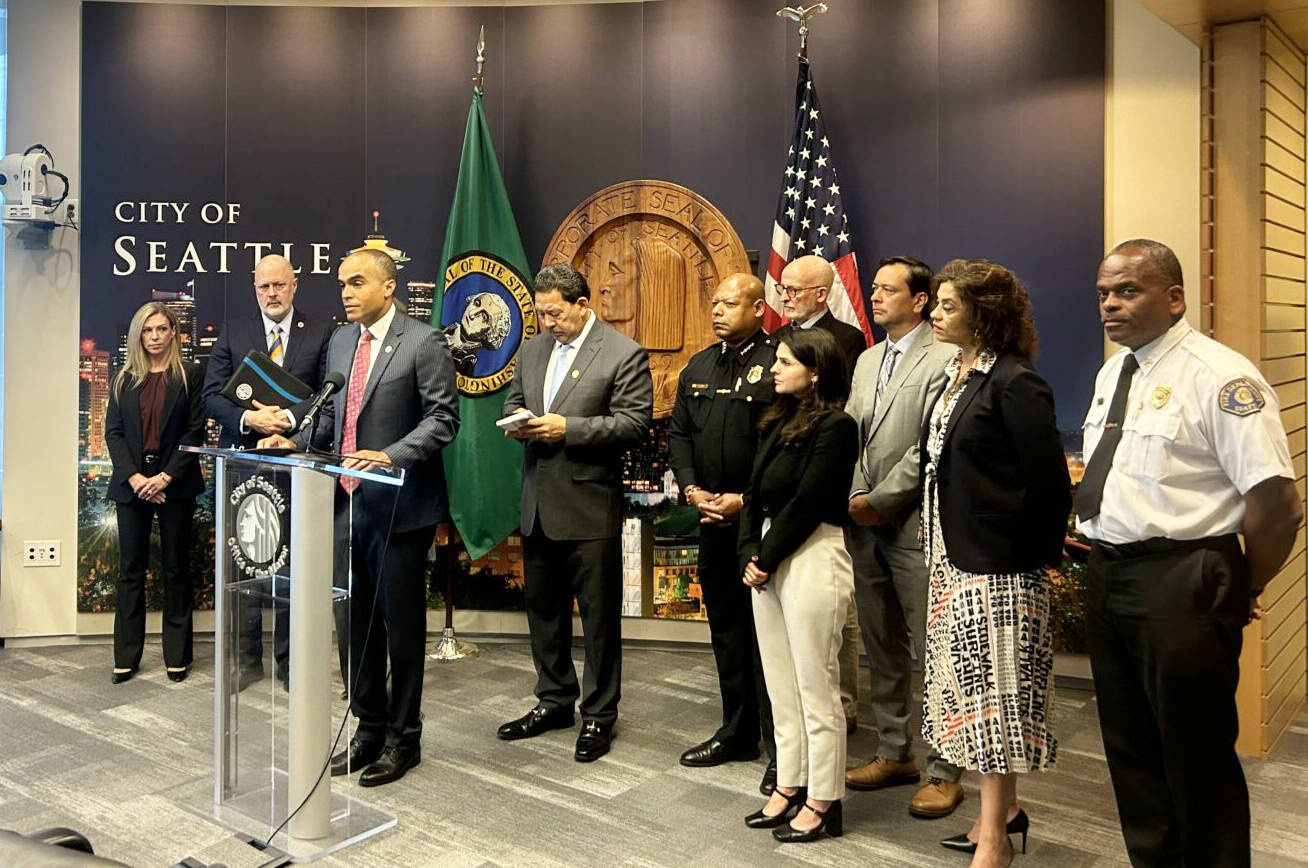 Washington state Attorney General Nick Brown speaks at a press conference alongside Seattle Mayor Bruce Harrell and other local officials on Monday, Sept. 29 at Seattle City Hall. (Photo by Jake Goldstein-Street/Washington State Standard)
