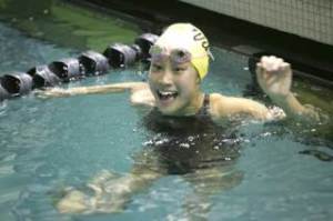 Inglemoor High freshman Leann Yee celebrates after finding out she finished in second place in the 100-yard freestyle during the 2008 Girls Sea-King District 2 Swim and Dive Championships last Saturday at Juanita High.