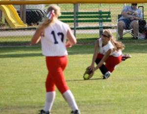North Bothell center fielder Rory Peterson snags a flyball as shortstop Tracy Rider prepares to assist during Washington's Game 3 of the Senior Softball Western Regional Tournament last Saturday in Missoula