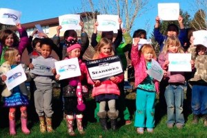 Woodinville Montessori School students celebrate the Seahawks' Superbowl victory at school this week.