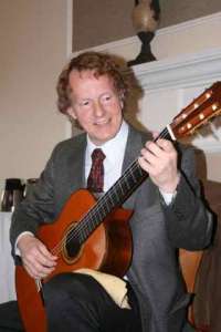 Bothell classical guitarist Gary Heimbigner performs at Chateau at Bothell Landing retirement center at lunchtime April 2. He started playing guitar at age 10
