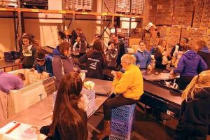 Players and coaches from the Bothell High School girls basketball team helped bag 9