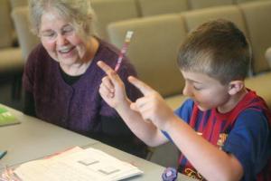 Kay Smith-Dechenne and Adrian Perez enjoy The Homework Club at Emmanuel Presbyterian Church in Bothell.