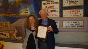 Elmer Skold presents Staci Adman with the Kenmore Heritage Society’s 11th annual McMaster Heritage Award Feb. 1 during the Founders’ Day observance at the Kenmore Community Center.