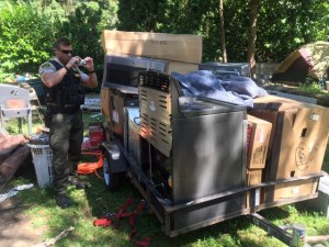 A Snohomish Sheriff officer photographs the stolen appliances