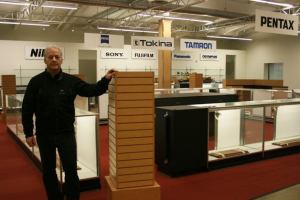 Bob Donovan stands inside the new Kenmore Camera store.