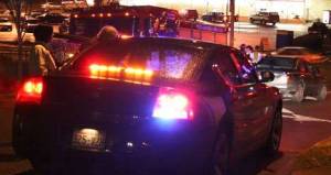 Kimi and Sue Toyoda speak with a Bothell Police officer tonight after they followed a swerving motorist into downtown Bothell.