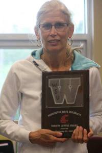 Bothell High's Yonni Mills with her Washington State University volleyball letter.