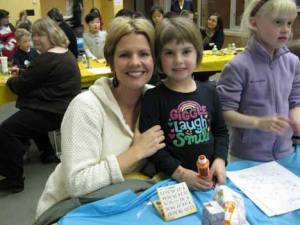 Heather and daughter Anna Erickson enjoy a fund-raising bingo night Feb. 25 at Evergreen Academy in Bothell. The $2