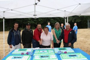 Kenmore Mayor David Baker (third from the left) and other city officials celebrated the city's 15th anniversary with the community during the final summer concert on Aug. 15.