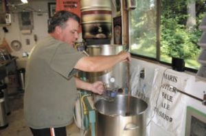 Jim Jamison brews up a batch of his Foggy Noggin beer in his unincorporated Snohomish County garage. TOM CORRIGAN