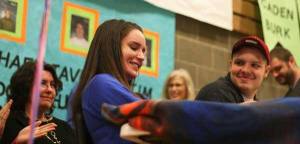 Bothell High seniors Shannon Schueren and Ryan Romeis share a laugh during Wednesday morning’s letter-of-intent signing event in the school commons. Schueren will play soccer at Boise State and Romeis will play football at Central Washington University.