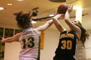 Inglemoor High's Kelly Conroy attempts a shot over Bishop Blanchet's Sara Dowling Wednesday night. Inglemoor won the nonleague game
