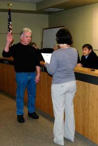 Jim McGaughey is sworn-in as a commissioner for Snohomish County Fire District 1. Administering the oath is Marsha Moore