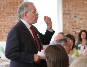 Cascadia Community College President Dr. Bill Christopher makes one of many points encouraging community support of the arts at the Northshore Performing Arts Center Foundation's 'Spring for the Arts' luncheon March 19 at the Hollywood Schoolhouse in Woodinville. More than 130 friends and supporters attended and donated more than $14