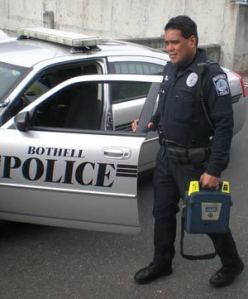 Bothell Police officer Robert Buendia with his AED.