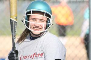 Britta McOmber jokes with a teammate during a Bothell High practice in March. She’s headed to Dartmouth College this fall.