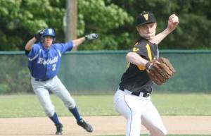 Inglemoor pitcher Gavin Harris fires away as Bothell runner Daniel Fredrickson rolls off second base during yesterday's 4A Kingco Tournament game. Inglemoor won
