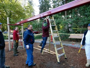 Kenmore Mayor David Baker helps out with the city's playground build last October at Rhododendron Park. The city will be able to build a new playground at Northshore Summit Park with a newly acquired grant.