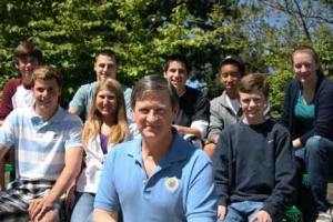 Inglemoor High DECA (Delta Epsilon Chi) adviser Dennis Rockwood is surrounded by some of  his nationally No. 1-ranked students. Top