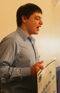 Brian Inch speaks to the crowd after receiving a $1