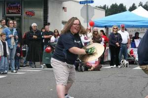 Lisa Rousu Brandhagen smashes her cymbals while the Seattle Seahawk Blue Thunder drum group entertains the crowd at last year's Riverfest.
