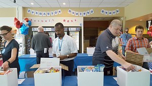 AT&T employee volunteers in Bothell box 300 care packages that will be delivered in the coming weeks to our Military Personal all around the world. Contributed photo
