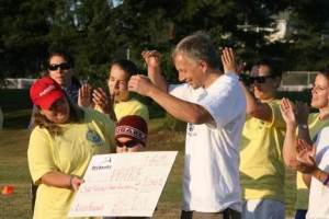 Kris and Brandon Brauns hand off a $1