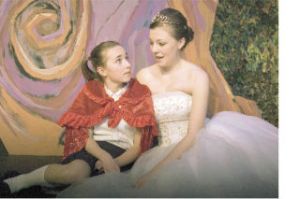 Little Red Riding Hood (Keaton Whittaker of Bothell) has a talk with Cinderella (Emma O’Melia) in Village Theatre’s KIDSTAGE production of “Into the Woods.” The musical runs through Jan. 18 at First Stage Theatre