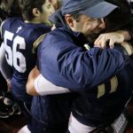 Cedar Park Christian football coach Bill Marsh hugs senior Josiah Sergeant following the Eagles&rsquo; 28-25 victory over Cedarcrest on Oct. 21 at Juanita High School. JOHN WILLIAM HOWARD/Bothell-Kenmore Reporter