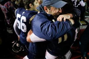 Cedar Park Christian football coach Bill Marsh hugs senior Josiah Sergeant following the Eagles&rsquo; 28-25 victory over Cedarcrest on Oct. 21 at Juanita High School. JOHN WILLIAM HOWARD/Bothell-Kenmore Reporter
