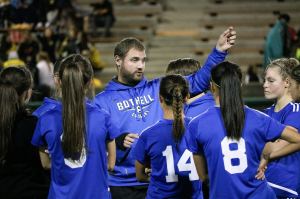 Bothell High girls soccer coach Shawn Warner speaks to his team at halftime of the Cougars&rsquo; 2-1 victory over Inglemoor in the season finale. JOHN WILLIAM HOWARD/Bothell-Kenmore Reporter