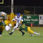 Richland&rsquo;s Parker McCary (21) attempts to drag down Bothell quarterback Jacob Sirmon (3) during Richland&rsquo;s 49-28 win over Bothell on Nov. 19 at Lampson Stadium in Kennewick. McCary also scored the go-ahead touchdown for the Bombers in the second quarter. GREG NELSON/Contributed photo