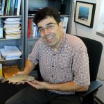 Dr. Jeff Jensen holds a Lake Washington Kokanee sample from 1888. He plans to use the Smithsonian find as a way to compare DNA from any Kokanee-looking fish that might turn up in Lake Washington streams. CELESTE GRACEY/Special to the Reporter