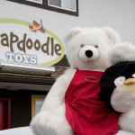 Jengo and Pengo, the two protagonists in a new children&rsquo;s book created by The StoryMakers, are photographed outside of Snapdoodle Toys. RON ALLEN/Contributed photo