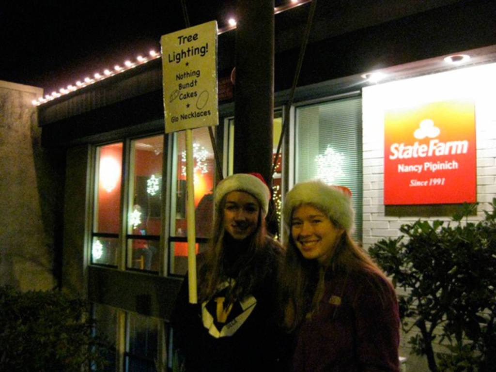 Student volunteers held signs at each activity.